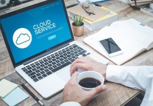 Employee on laptop using the Cloud